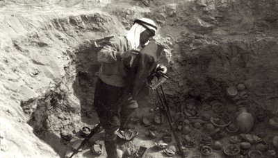Professor John Garstang photographing broken pottery in situ at the Jericho excavations by English Photographer